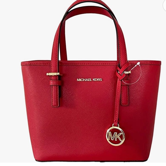 Michael Kors Handbags - Micheal Kors Large zip Jet Set Tote. Red and used only one time.